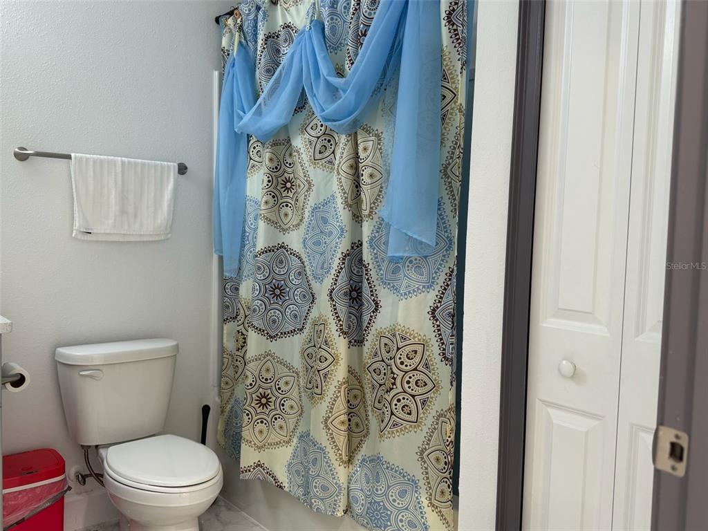 2050 Florida Development Road, Unit B Davenport, FL 33837 - Photo 9 of 16 a white toilet sitting next to a bathroom sink