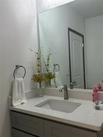 a bathroom with a sink and a mirror