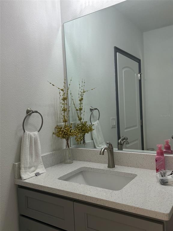 2050 Florida Development Road, Unit B Davenport, FL 33837 - Photo 10 of 16 a bathroom with a sink and a mirror