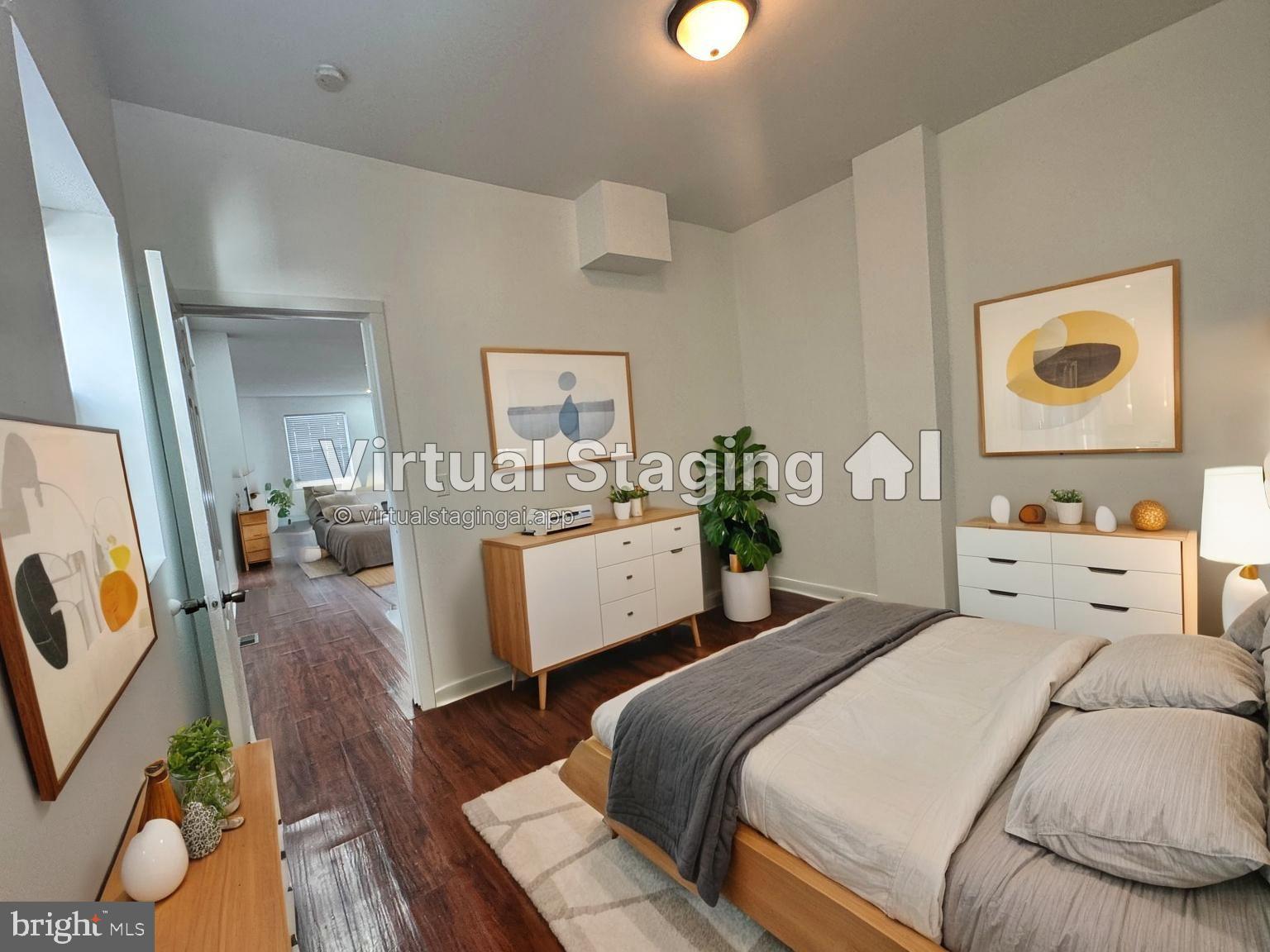 126 North Paxon Street Philadelphia, PA 19139 - Photo 15 of 38 a bedroom with a bed and wooden floor