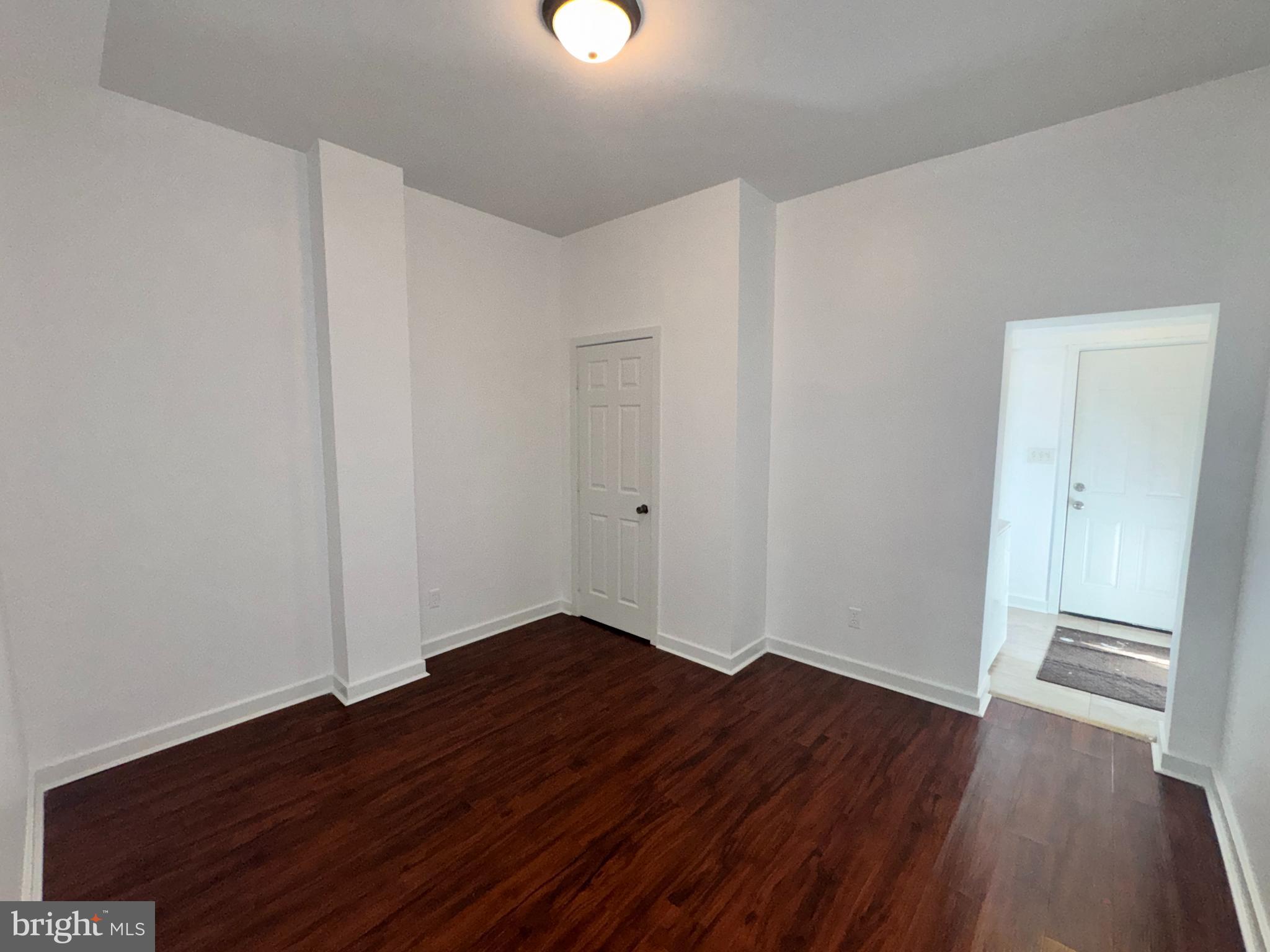 126 North Paxon Street Philadelphia, PA 19139 - Photo 16 of 38 a view of an empty room with wooden floor