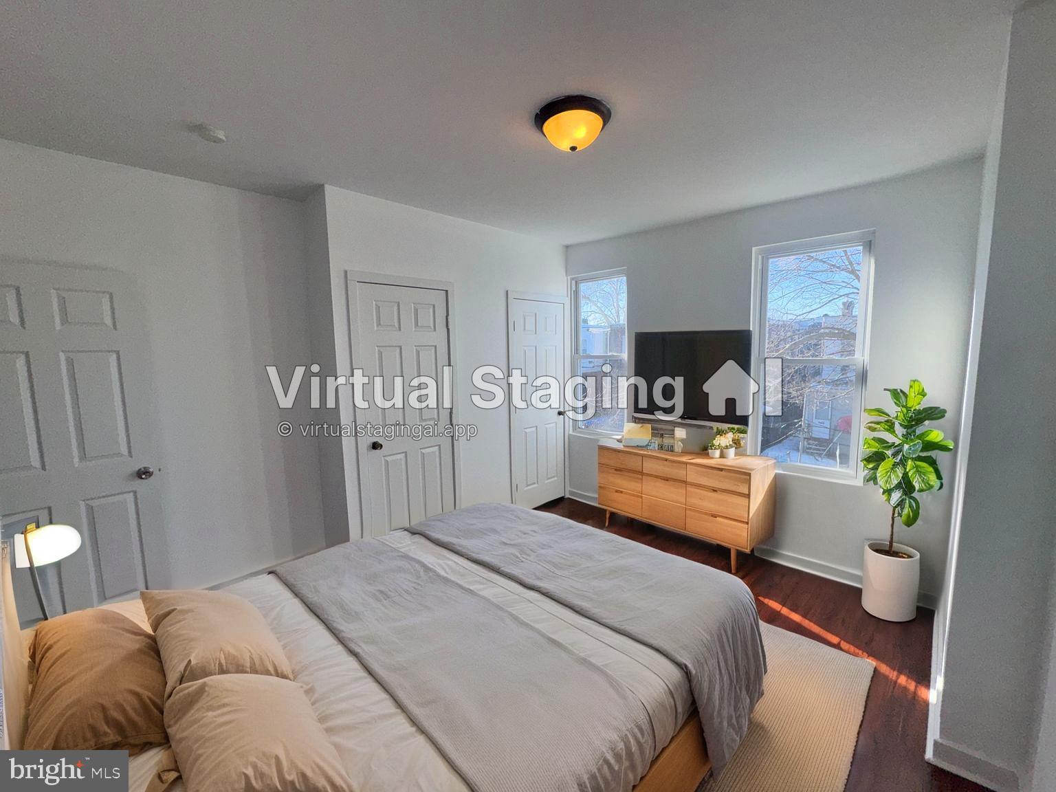 126 North Paxon Street Philadelphia, PA 19139 - Photo 20 of 38 a bedroom with a bed and a chandelier