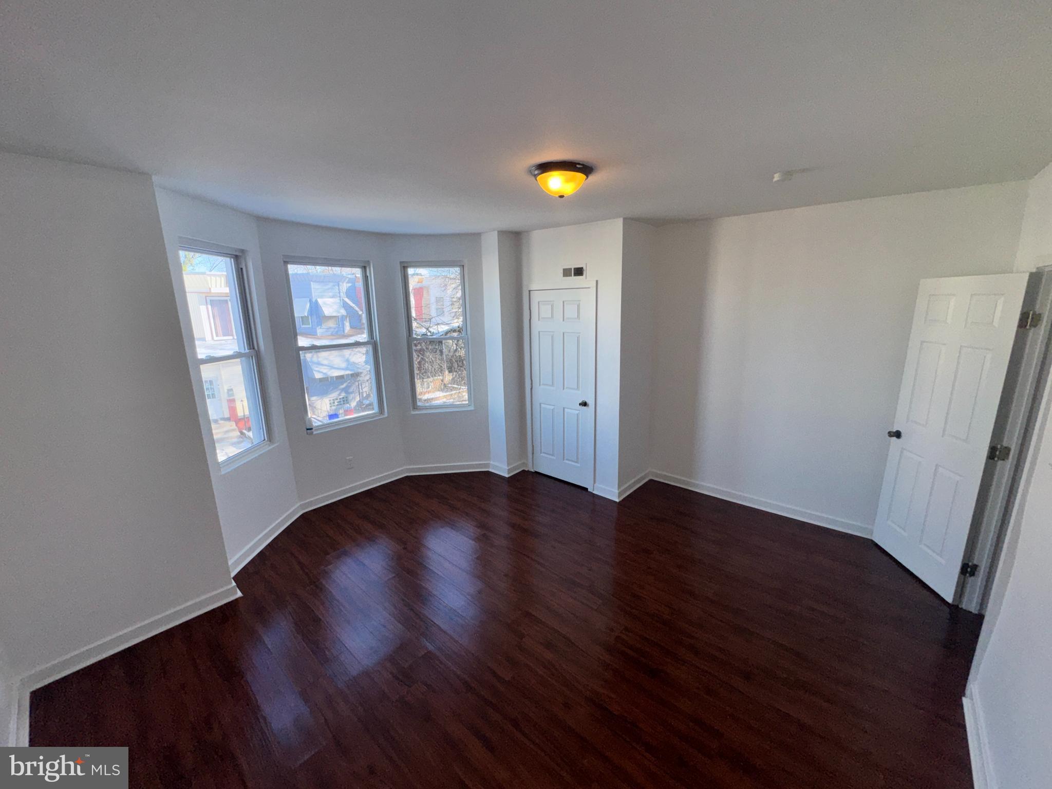 126 North Paxon Street Philadelphia, PA 19139 - Photo 29 of 38 an empty room with wooden floor and windows