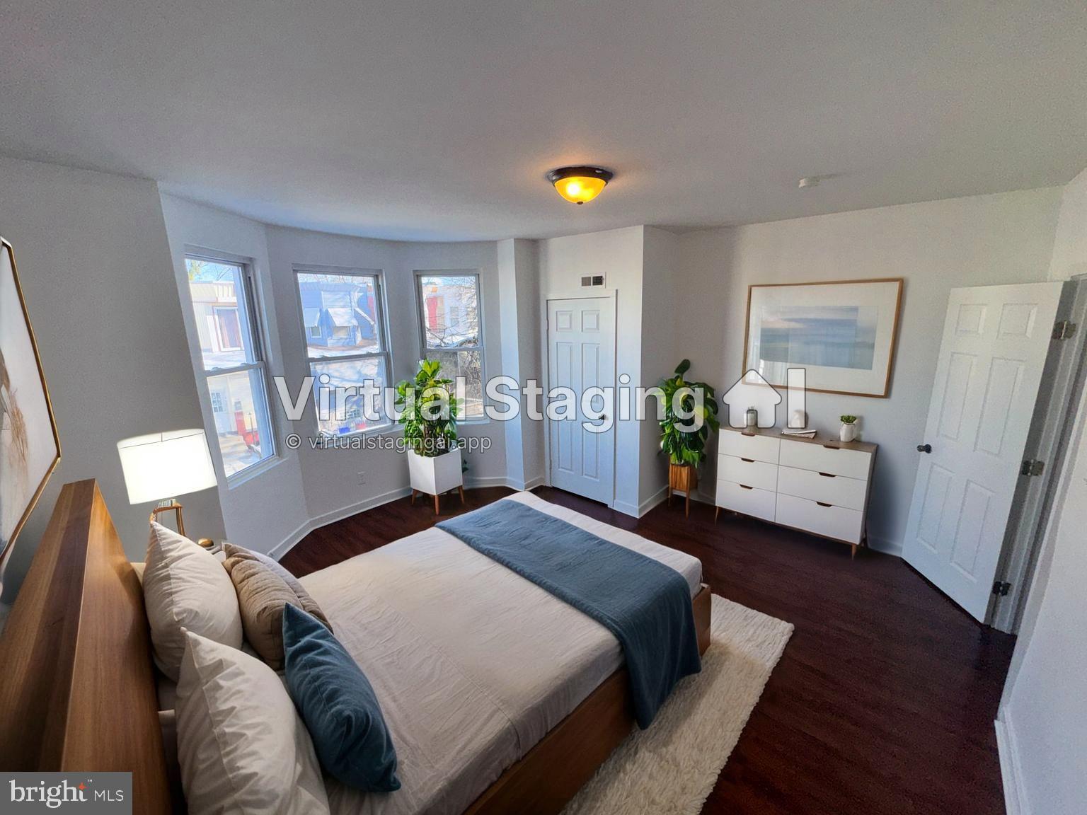 126 North Paxon Street Philadelphia, PA 19139 - Photo 30 of 38 a bedroom with a bed and a couch