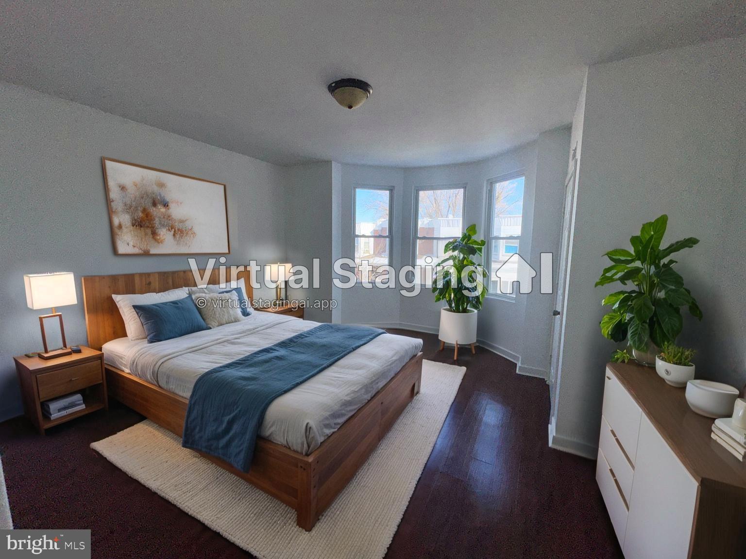 126 North Paxon Street Philadelphia, PA 19139 - Photo 32 of 38 a bedroom with bed and wooden floor