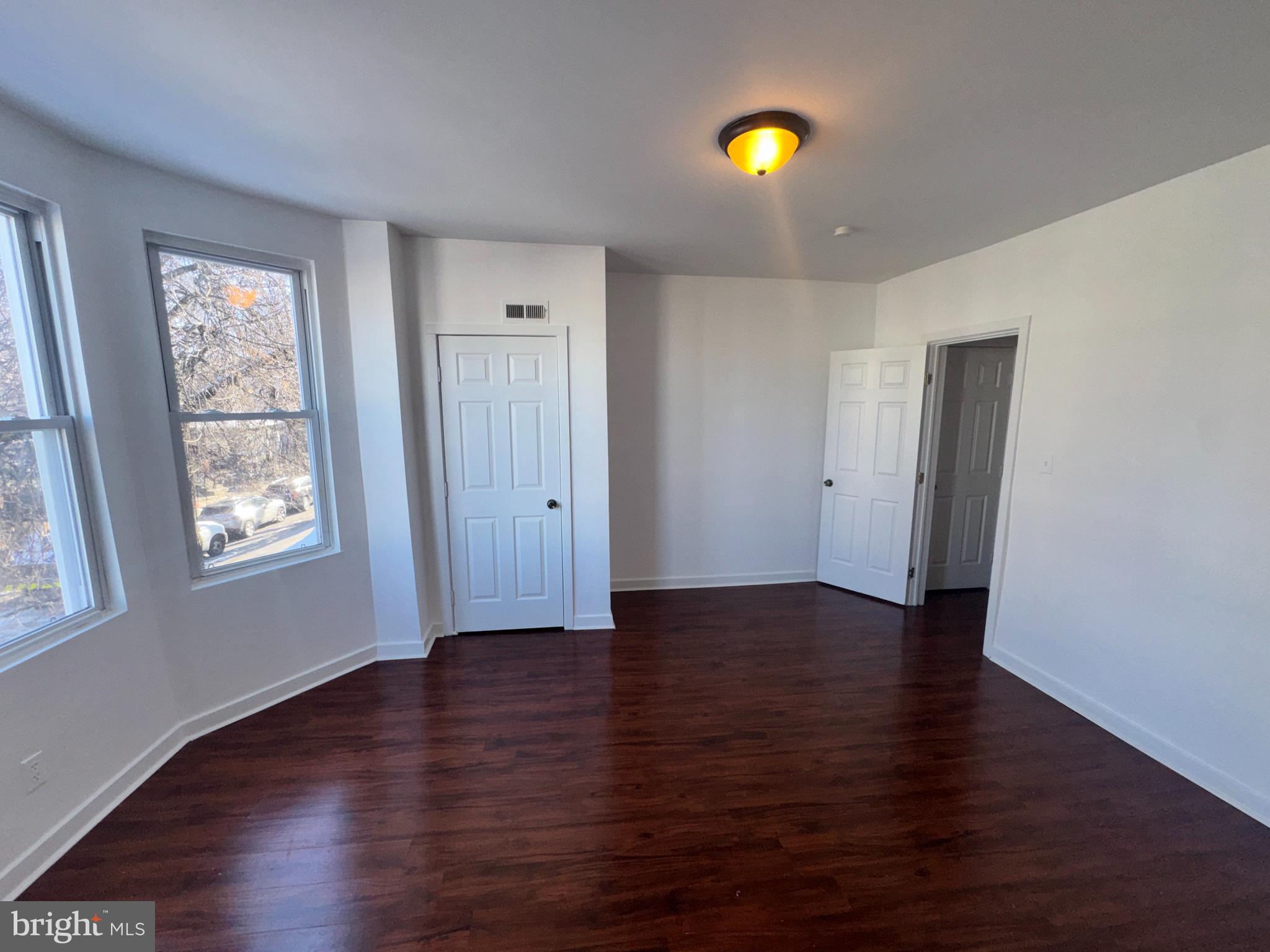 126 North Paxon Street Philadelphia, PA 19139 - Photo 33 of 38 an empty room with wooden floor and windows