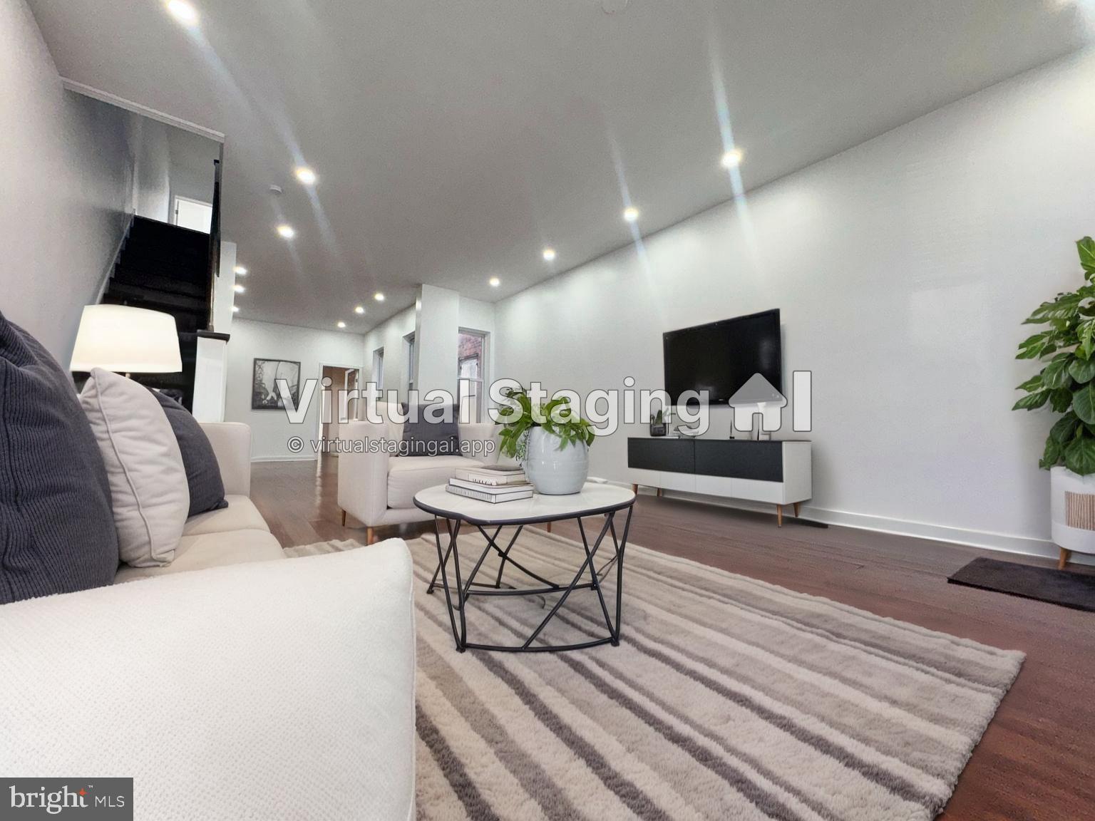 126 North Paxon Street Philadelphia, PA 19139 - Photo 8 of 38 a living room with furniture and a flat screen tv