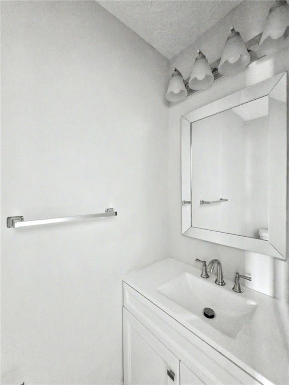 48 Savanna Court Powder Springs, GA 30127 - Photo 15 of 28 a bathroom with a sink and a mirror