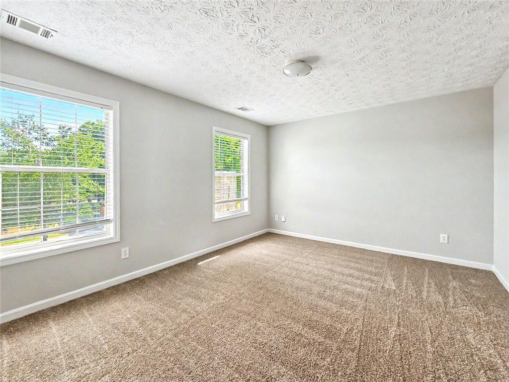 48 Savanna Court Powder Springs, GA 30127 - Photo 23 of 28 an empty room with windows