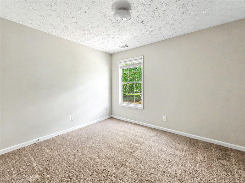 48 Savanna Court Powder Springs, GA 30127 - Photo 24 of 28 an empty room with a empty space and a window