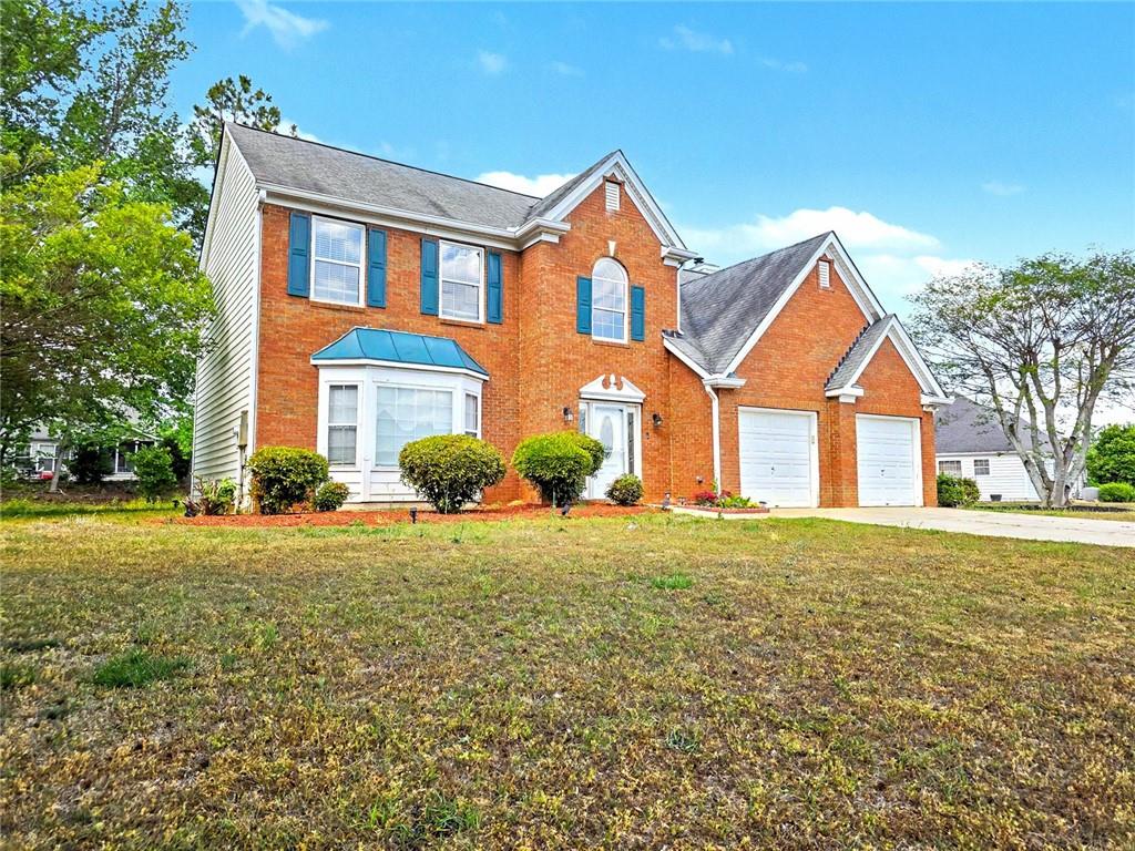 48 Savanna Court Powder Springs, GA 30127 - Photo 4 of 28 a front view of a house with garden