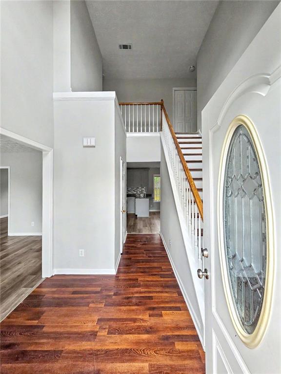 48 Savanna Court Powder Springs, GA 30127 - Photo 5 of 28 a view of a hallway with wooden floor and entryway