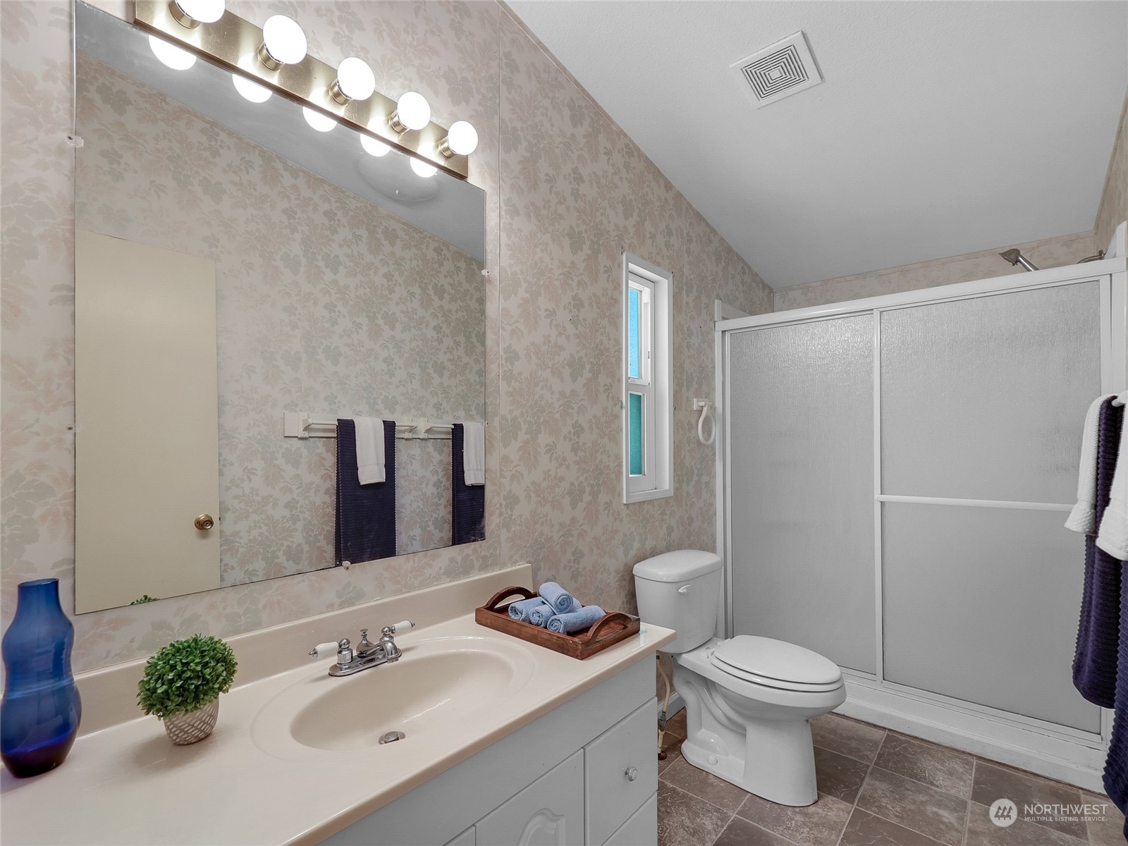 30511 Stackpole Lane Ocean Park, WA 98640 - Photo 11 of 40 a bathroom with a sink a toilet a mirror and shower