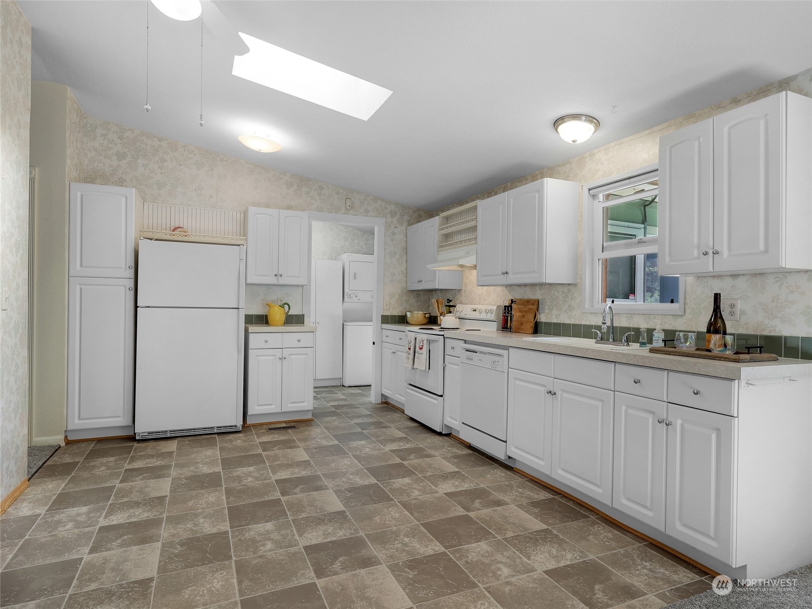 30511 Stackpole Lane Ocean Park, WA 98640 - Photo 14 of 40 a kitchen with cabinets and white stainless steel appliances