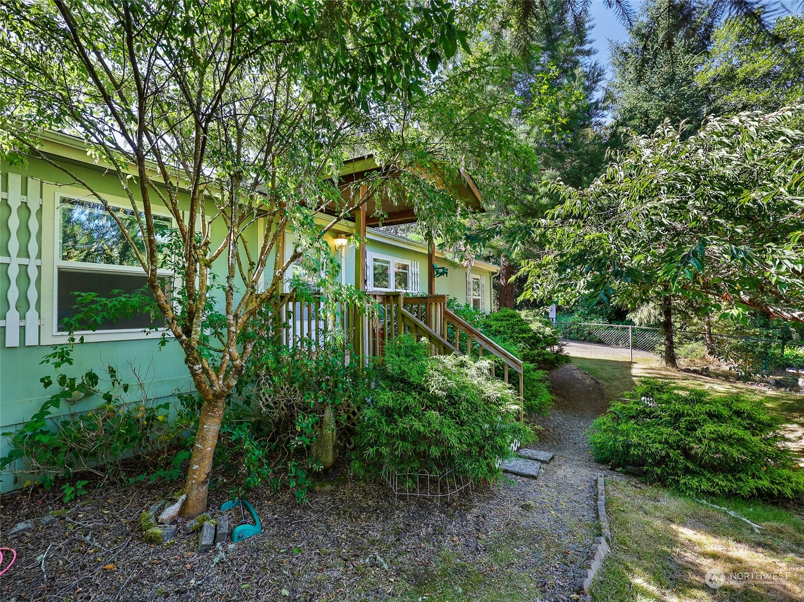 30511 Stackpole Lane Ocean Park, WA 98640 - Photo 2 of 40 a backyard of a house with lots of green space