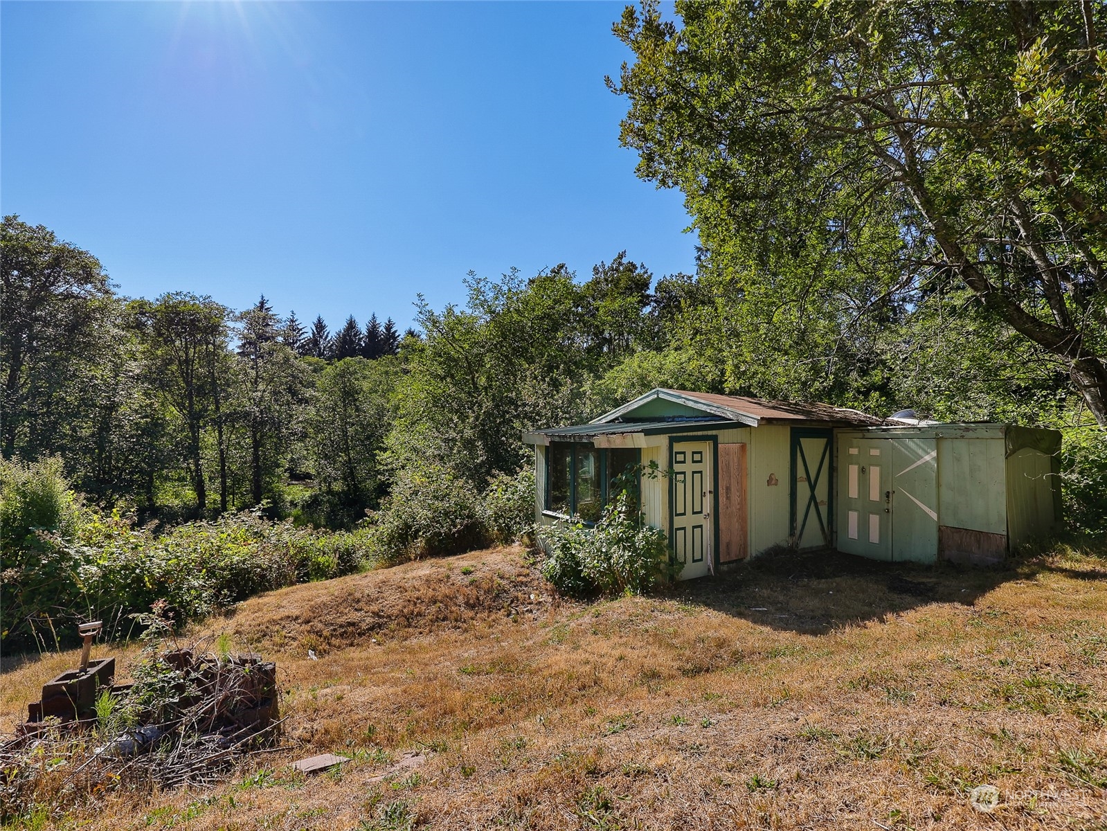 30511 Stackpole Lane Ocean Park, WA 98640 - Photo 33 of 40 a front view of a house with a yard and trees