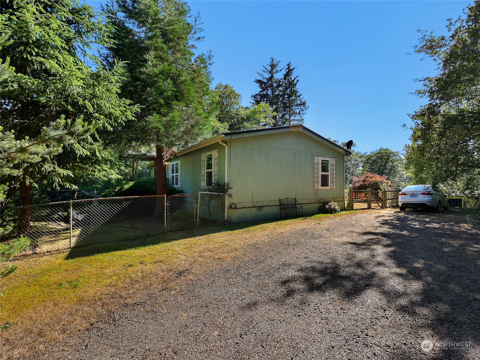 30511 Stackpole Lane Ocean Park, WA 98640 - Photo 35 of 40 a backyard of a house with lots of green space