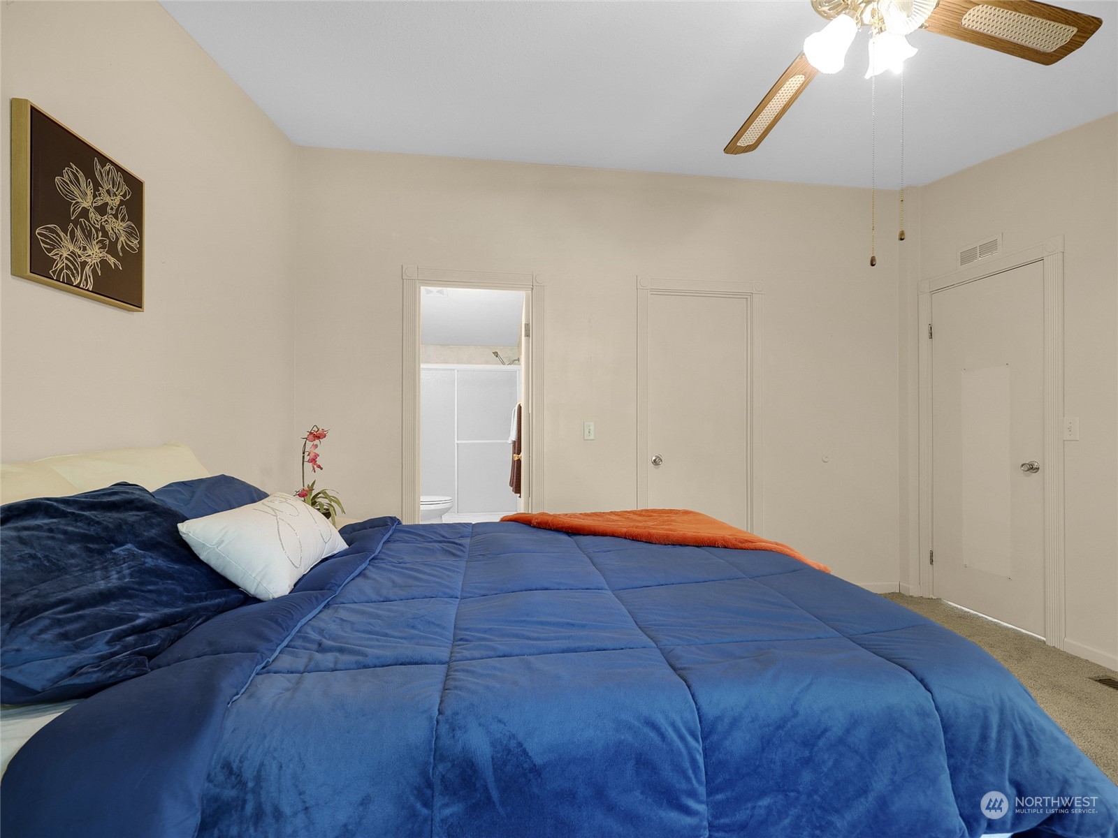 30511 Stackpole Lane Ocean Park, WA 98640 - Photo 10 of 40 a bedroom with a bed and a lamp on the dresser