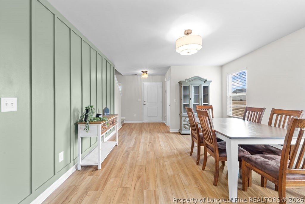81 Merlin Court Godwin, NC 28344 - Photo 13 of 34 a view of a dining room with furniture window and wooden floor