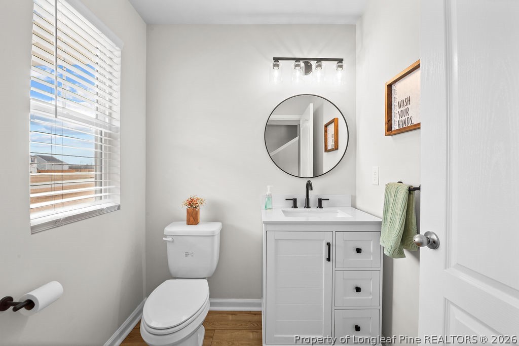 81 Merlin Court Godwin, NC 28344 - Photo 14 of 34 a bathroom with a toilet sink and mirror