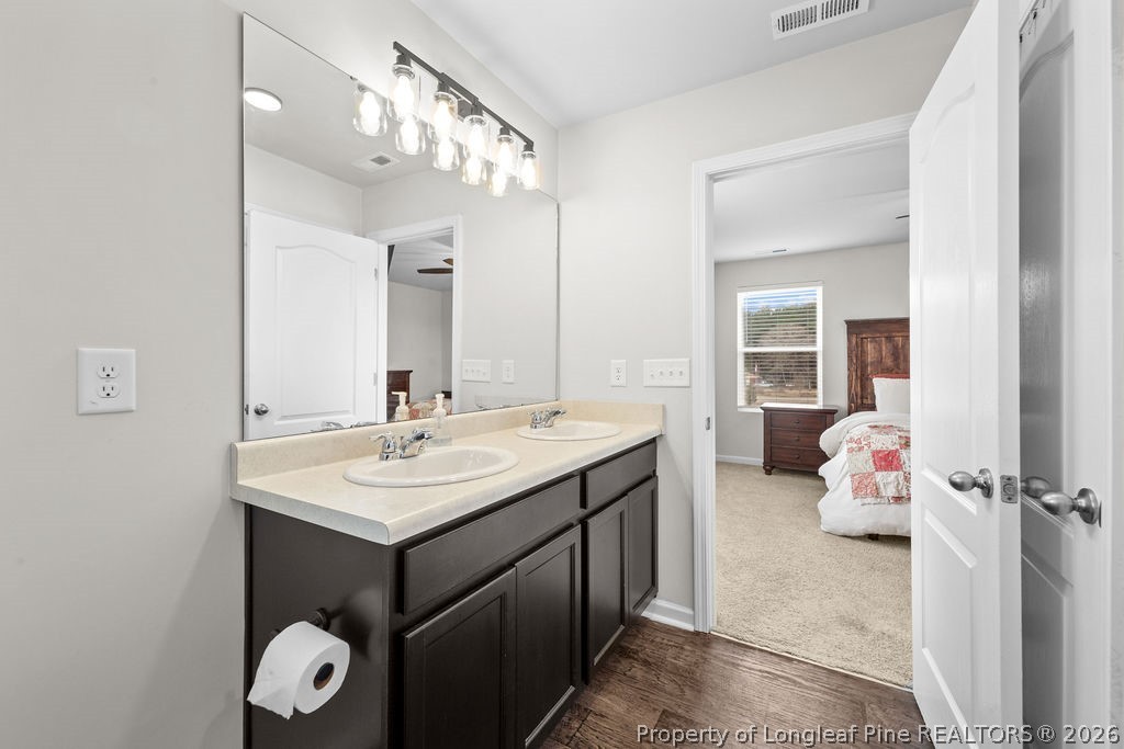 81 Merlin Court Godwin, NC 28344 - Photo 19 of 34 a en suite bathroom with a sink vanity and mirror