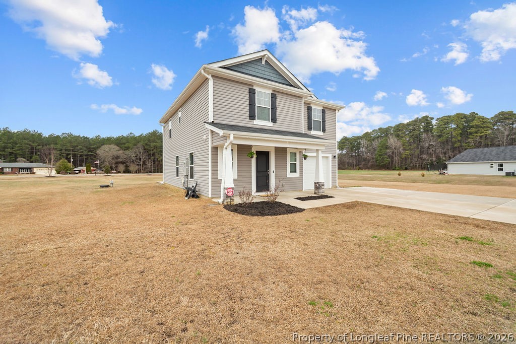 81 Merlin Court Godwin, NC 28344 - Photo 2 of 34 a view of patio with a garden