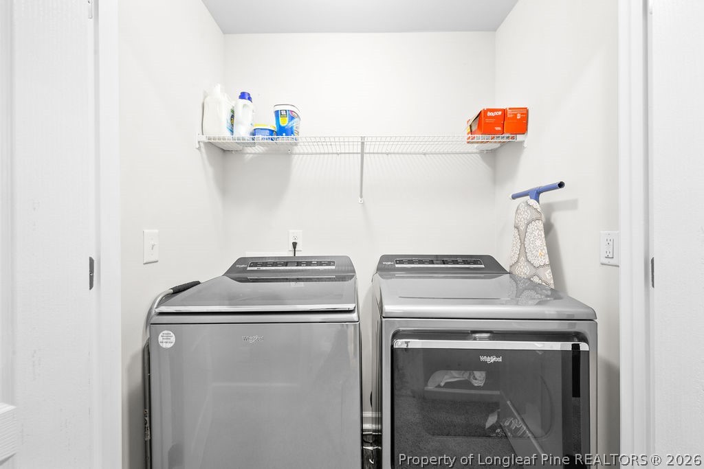 81 Merlin Court Godwin, NC 28344 - Photo 29 of 34 a utility room with dryer and washer