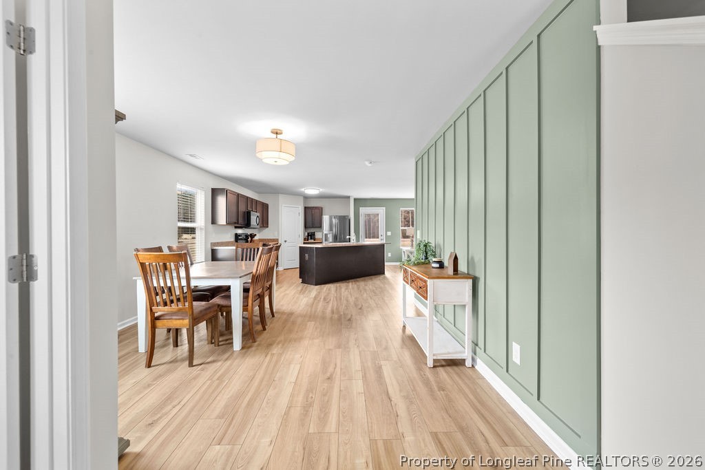 81 Merlin Court Godwin, NC 28344 - Photo 4 of 34 a dining room with furniture and wooden floor