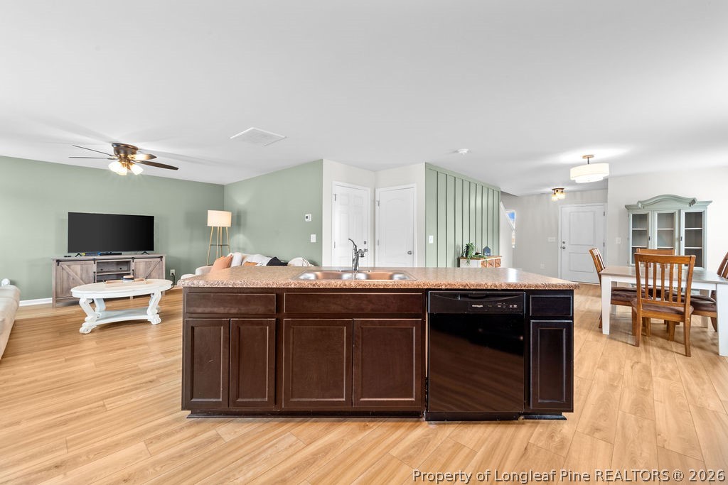 81 Merlin Court Godwin, NC 28344 - Photo 8 of 34 a kitchen with a sink and cabinets