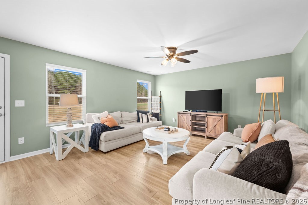 81 Merlin Court Godwin, NC 28344 - Photo 9 of 34 a living room with furniture and a flat screen tv