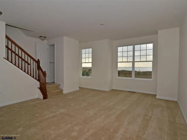 a view of an empty room with windows