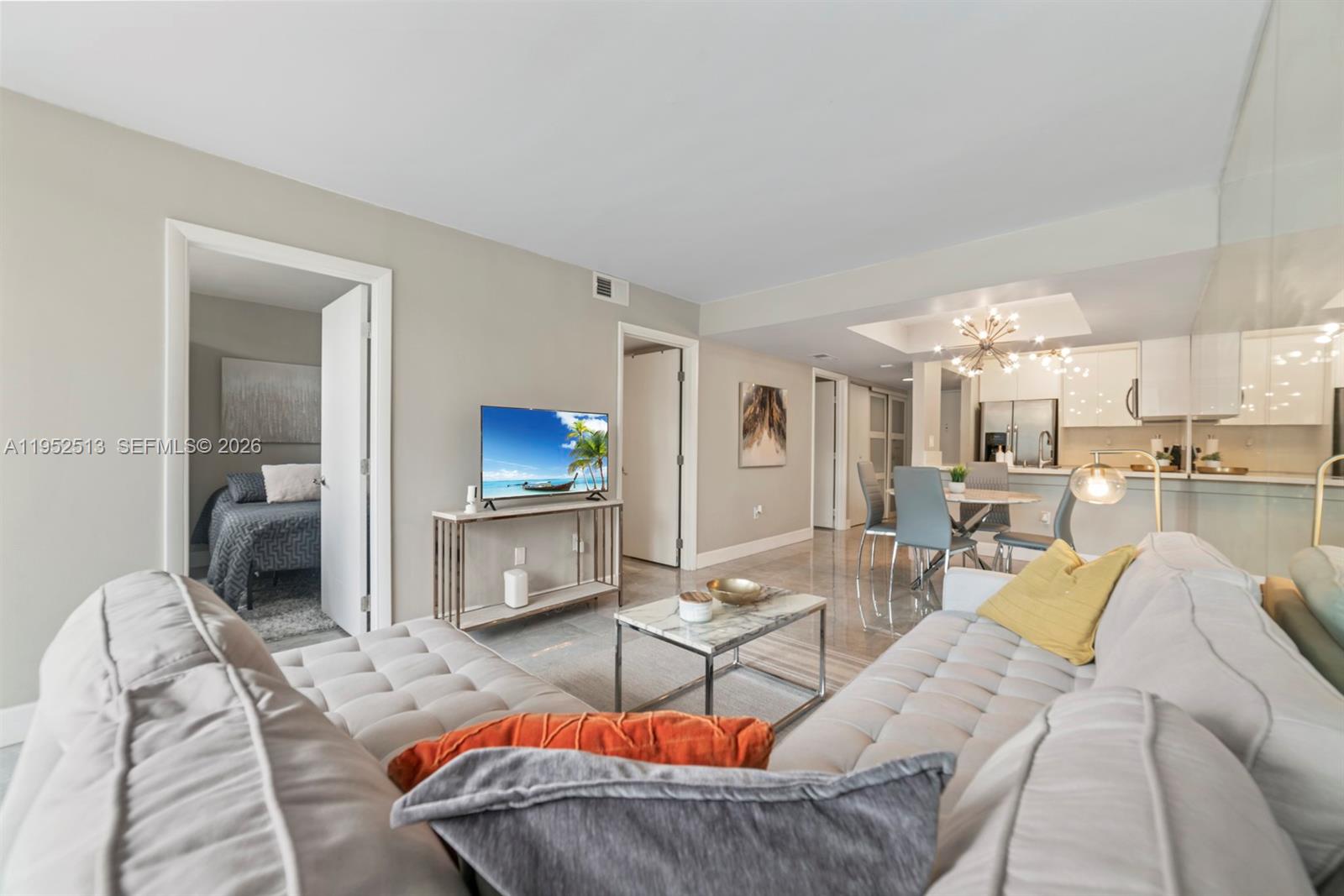 8002 Southwest 149th Avenue, Unit B118 Miami, FL 33193 - Photo 14 of 23 a living room with furniture and a wooden floor