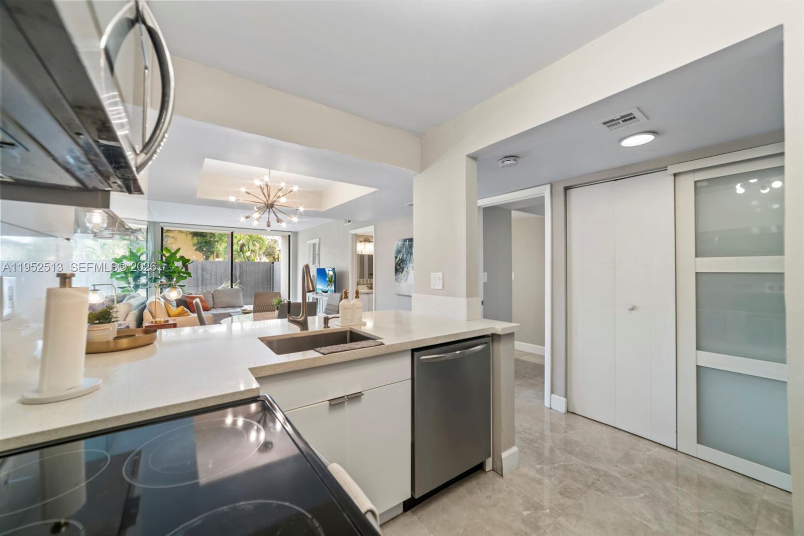 8002 Southwest 149th Avenue, Unit B118 Miami, FL 33193 - Photo 15 of 23 a kitchen with a sink appliances and cabinets
