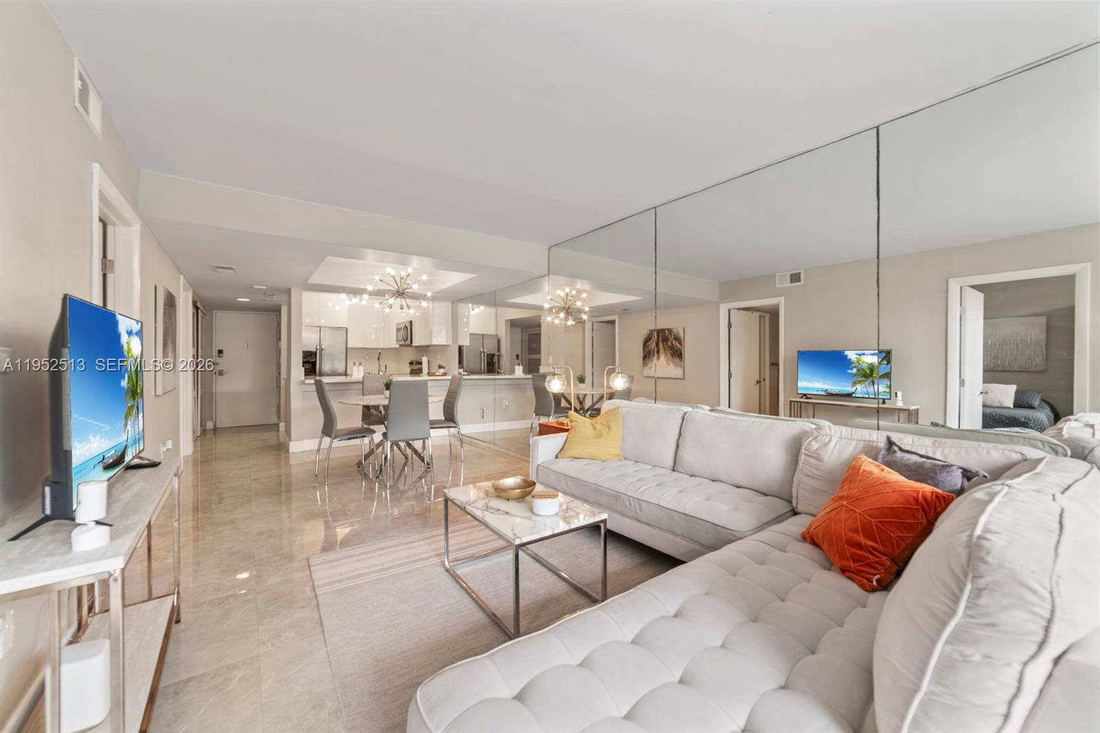 8002 Southwest 149th Avenue, Unit B118 Miami, FL 33193 - Photo 2 of 23 a living room with furniture and a flat screen tv