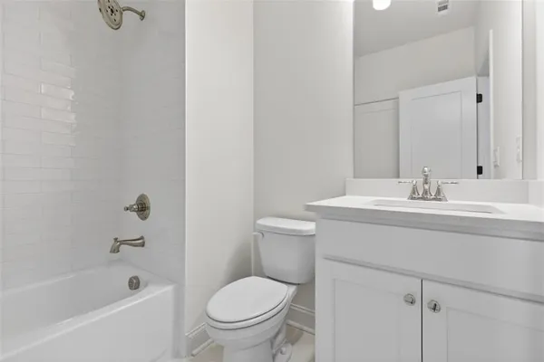 a bathroom with a bathtub and shower