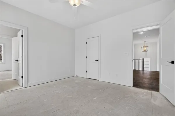 a view of a house with snow on the road