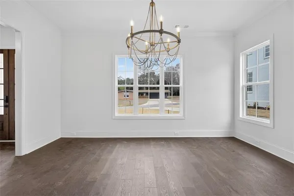 a kitchen with kitchen island granite countertop stainless steel appliances cabinets a sink and a counter top