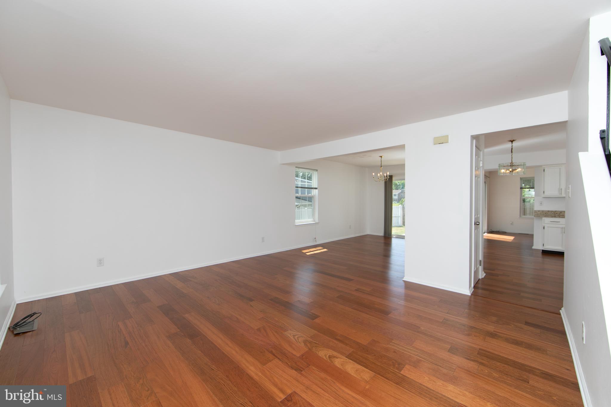 3007 Rampart Road Bensalem, PA 19020 - Photo 8 of 48 a view of a big room with wooden floor and a bathroom