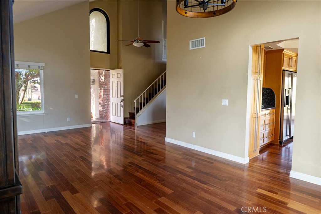 1202 Villanova Place Riverside, CA 92506 - Photo 15 of 59 a view of a hallway with wooden floor and a living room