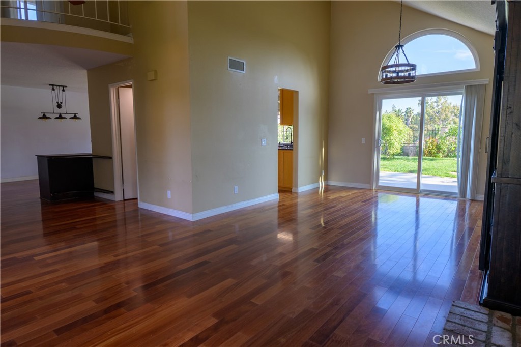 1202 Villanova Place Riverside, CA 92506 - Photo 19 of 59 a view of a hallway view with wooden floor and staircase