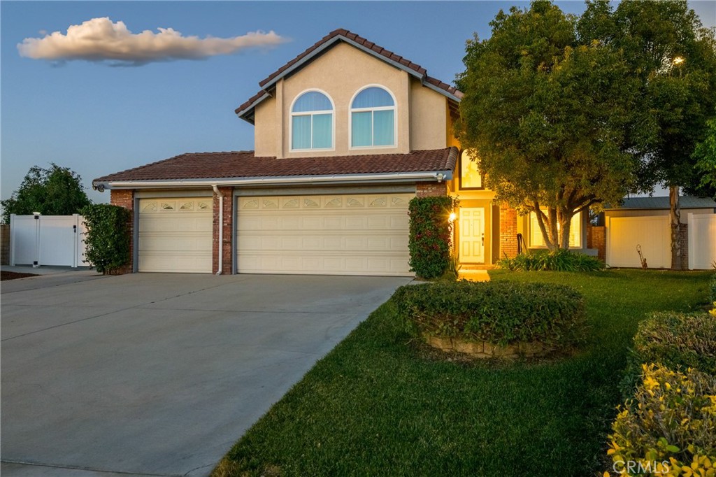 1202 Villanova Place Riverside, CA 92506 - Photo 5 of 59 a front view of a house with a yard and garage