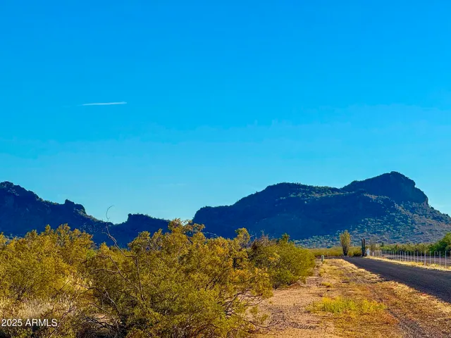 a view of an ocean and a mountain