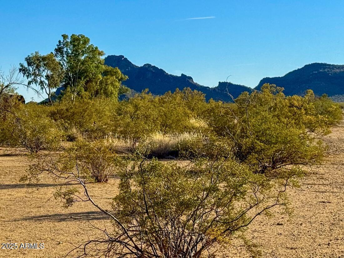 0 West Williams Road Aguila, AZ 85320 - Photo 8 of 21 a view of a large building with a mountain in the background