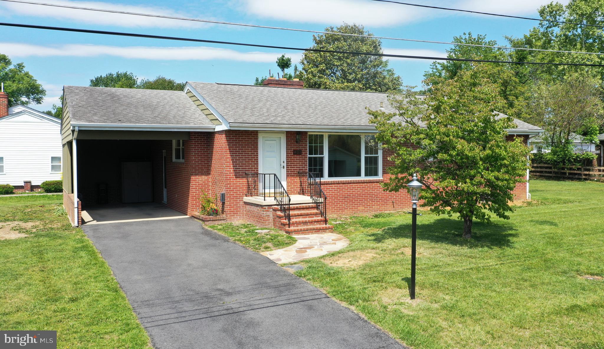 437 Beechcroft Road Winchester, VA 22601 - Photo 6 of 52 a front view of a house with a yard