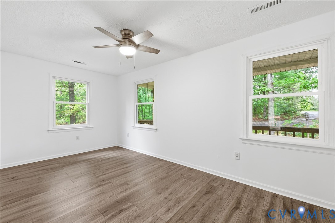 3220 Greenway Road Gladstone, VA 24553 - Photo 17 of 29 a view of wooden floor and windows in a room