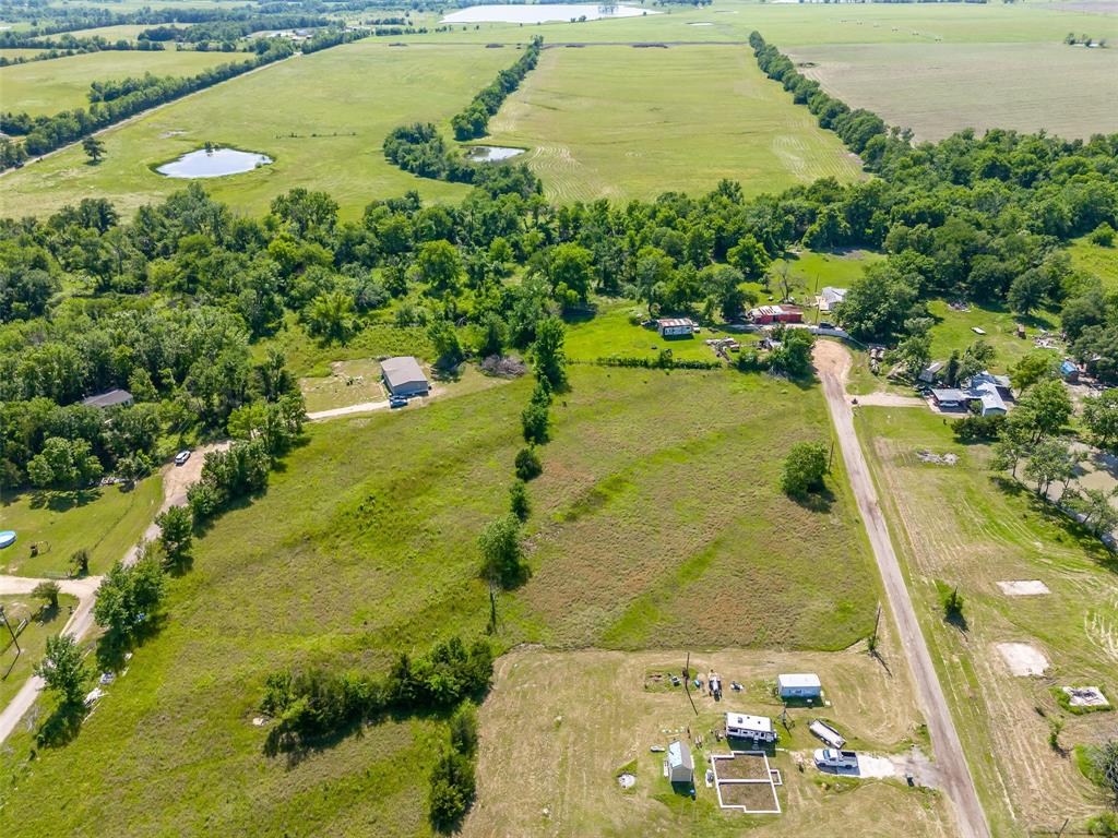 23070 County Road Powderly, TX 75473 - Photo 13 of 35 a view of a lake with a yard
