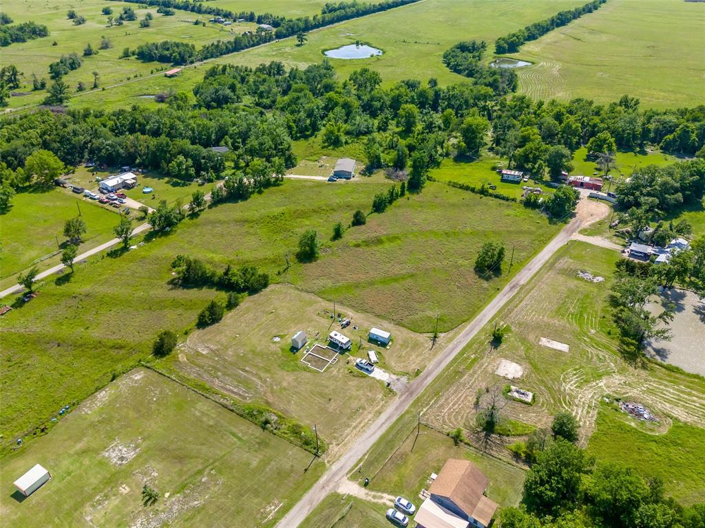 23070 County Road Powderly, TX 75473 - Photo 15 of 35 a view of a lake with a yard