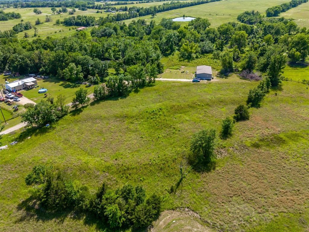 23070 County Road Powderly, TX 75473 - Photo 23 of 35 a view of a yard with an outdoor space