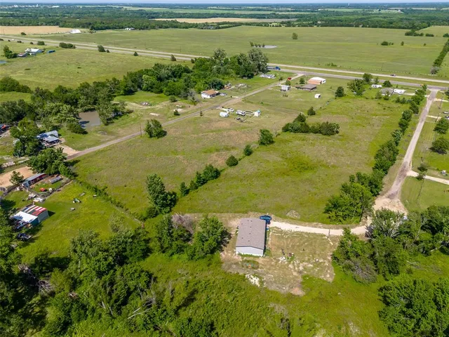 a view of a swimming pool with a yard