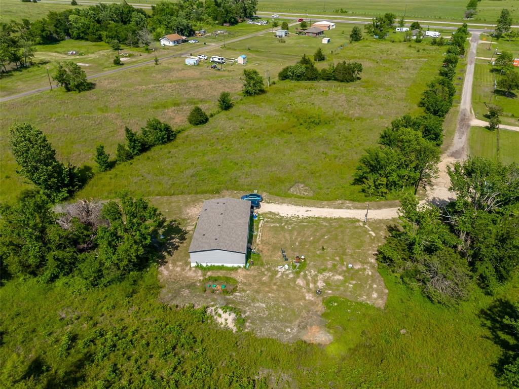 23070 County Road Powderly, TX 75473 - Photo 33 of 35 a view of a lake with a houses